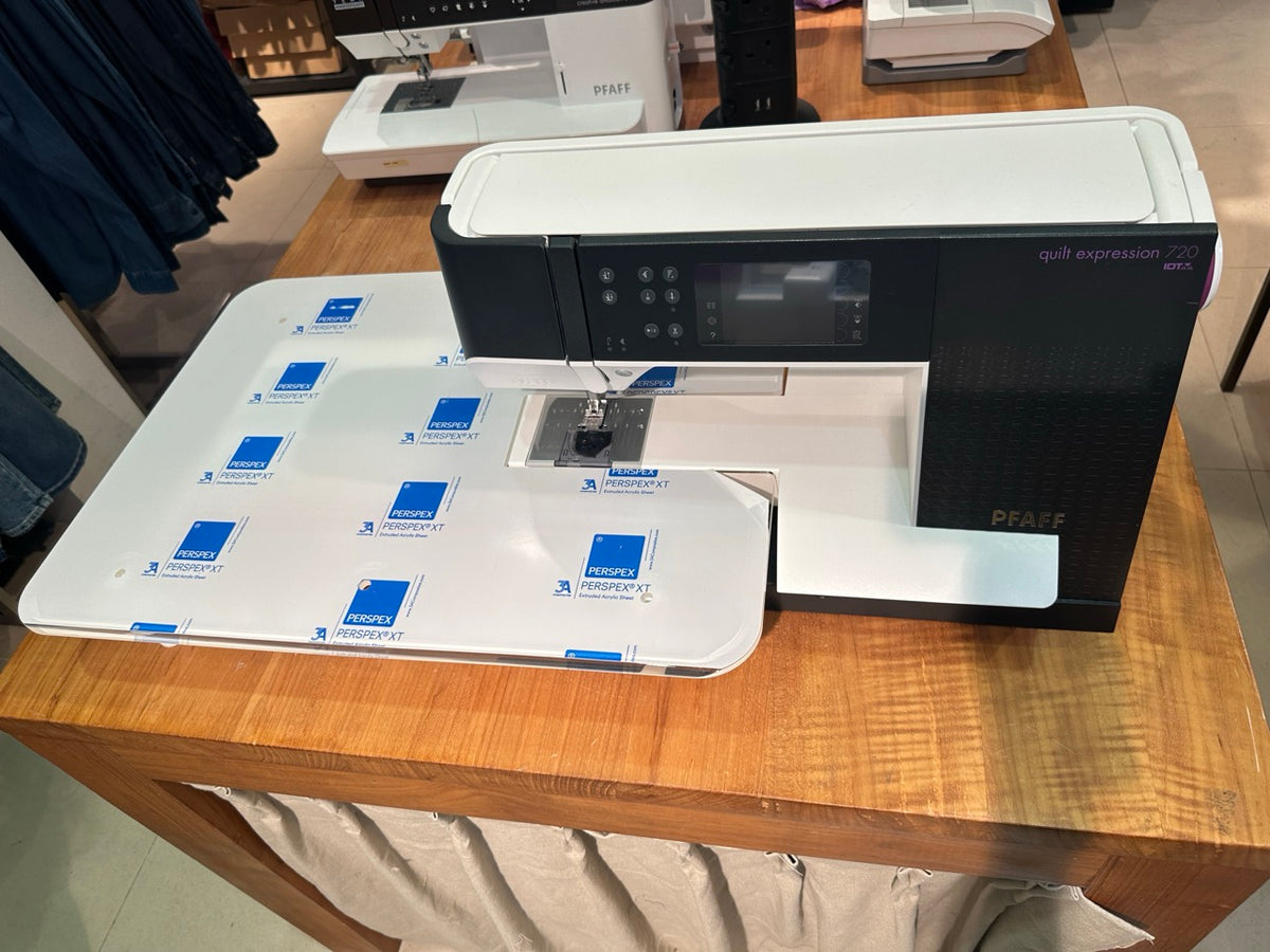 PFAFF Quilt Expression™ 720 Huge Throat Space setup with the Quilt Table. Table size: 24 x 18 inches